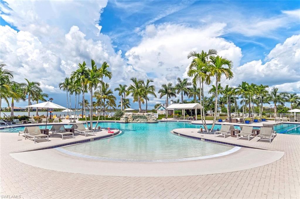 14940 Edgewater Circle Naples, FL 34114 - Photo 29 of 39 a view of a swimming pool with a patio