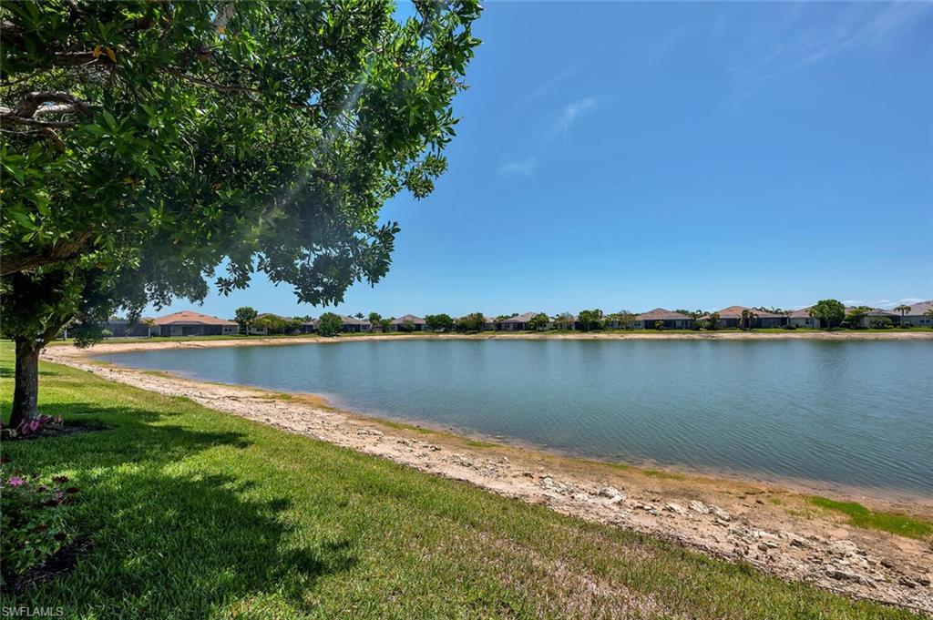 14940 Edgewater Circle Naples, FL 34114 - Photo 3 of 39 a view of a lake with a lake