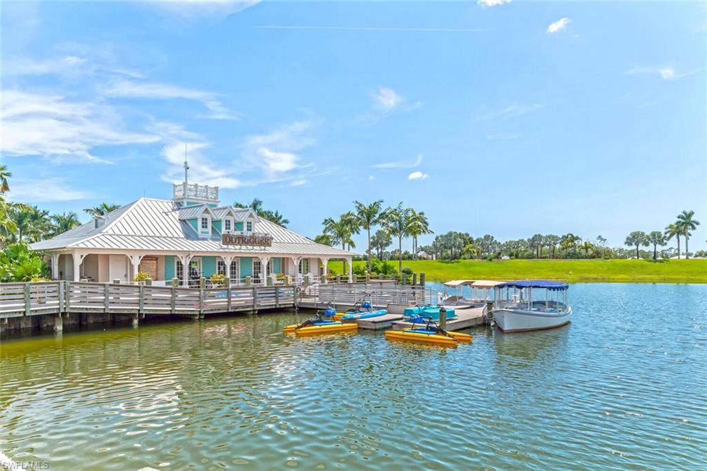 14940 Edgewater Circle Naples, FL 34114 - Photo 31 of 39 an aerial view of a swimming pool with outdoor seating