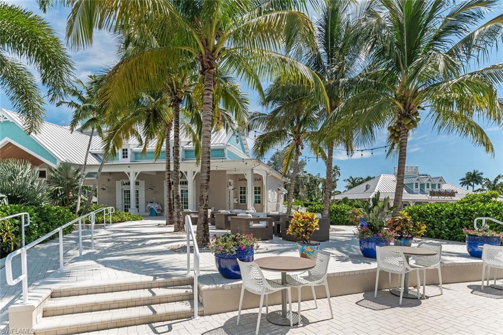 14940 Edgewater Circle Naples, FL 34114 - Photo 35 of 39 a row of palm trees in front of a house