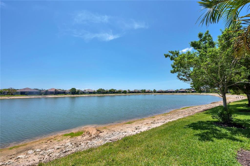 14940 Edgewater Circle Naples, FL 34114 - Photo 4 of 39 a view of a lake with a lake