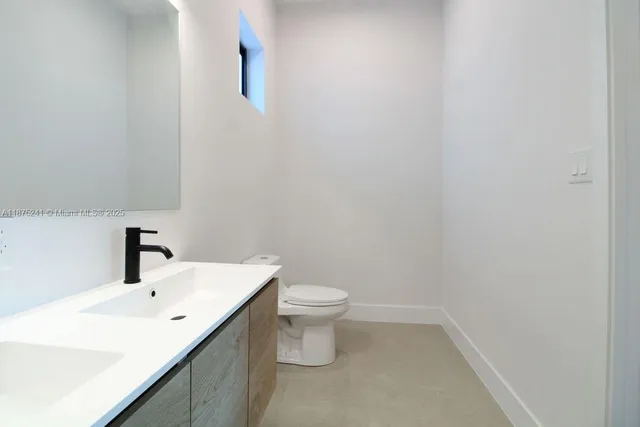 a bathroom with a sink and a toilet
