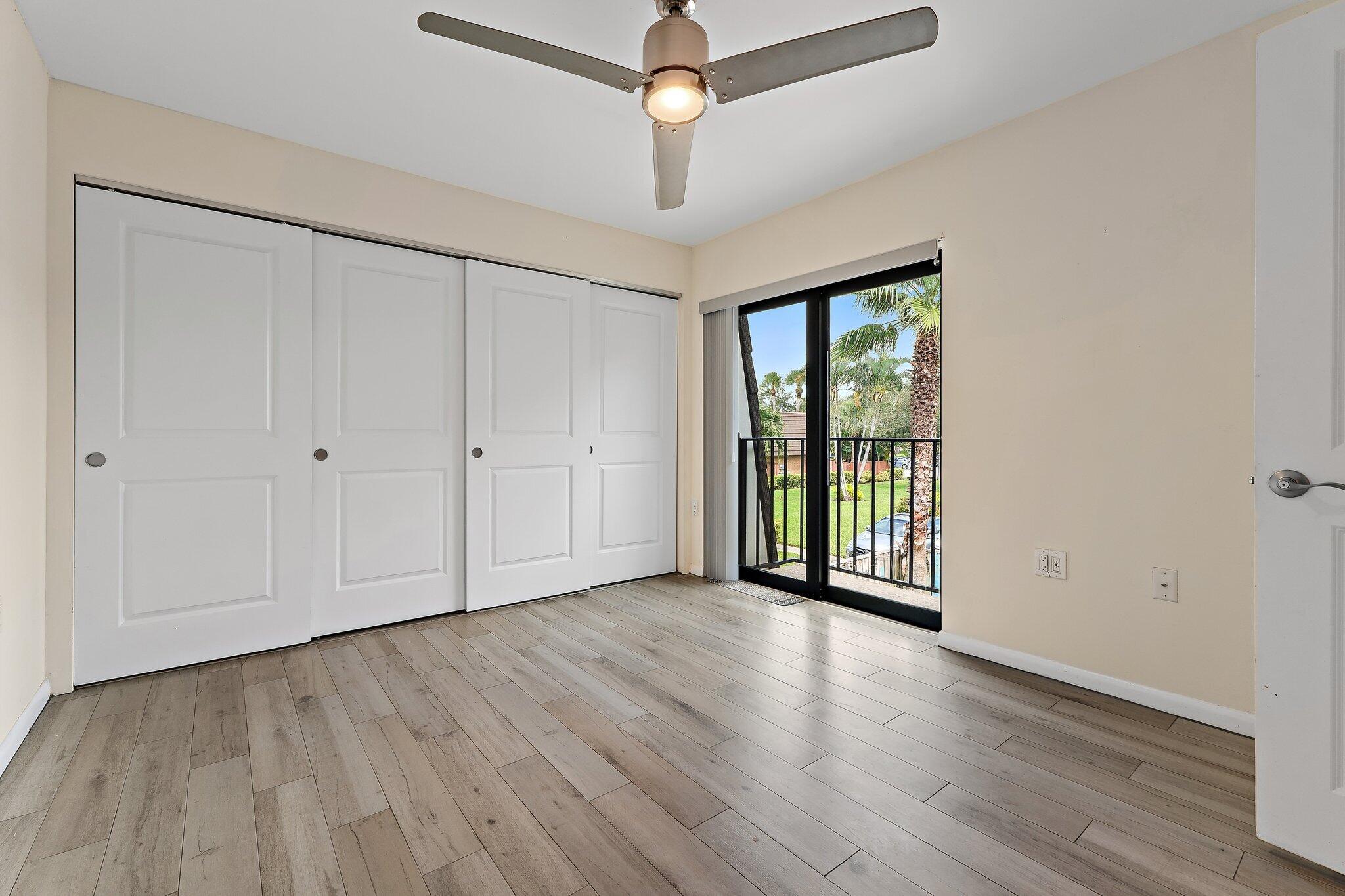 1514 15th Court Jupiter, FL 33477 - Photo 20 of 25 wooden floor in an empty room with a window