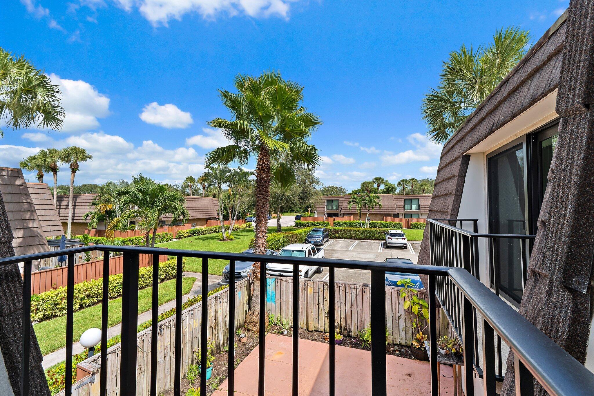 1514 15th Court Jupiter, FL 33477 - Photo 22 of 25 a view of a lake from a balcony