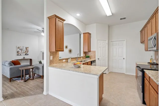 a kitchen with a sink and cabinets