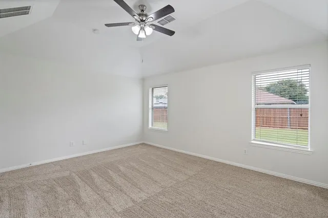 a spacious bathroom with a granite countertop sink and a mirror