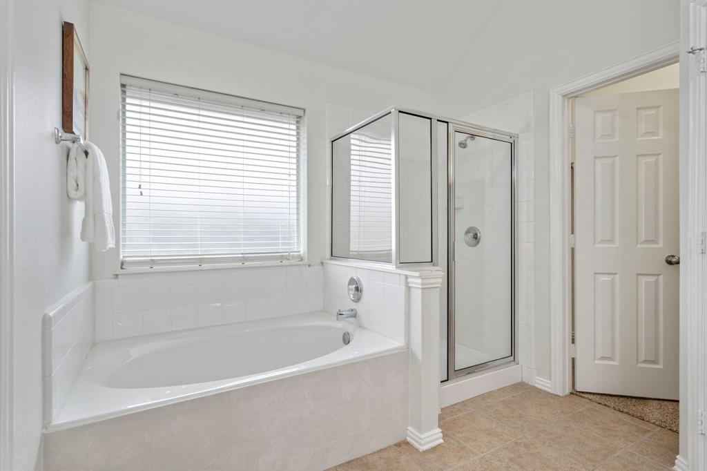 613 Hummingbird Trail Crowley, TX 76036 - Photo 21 of 37 a white bath tub sitting next to a window