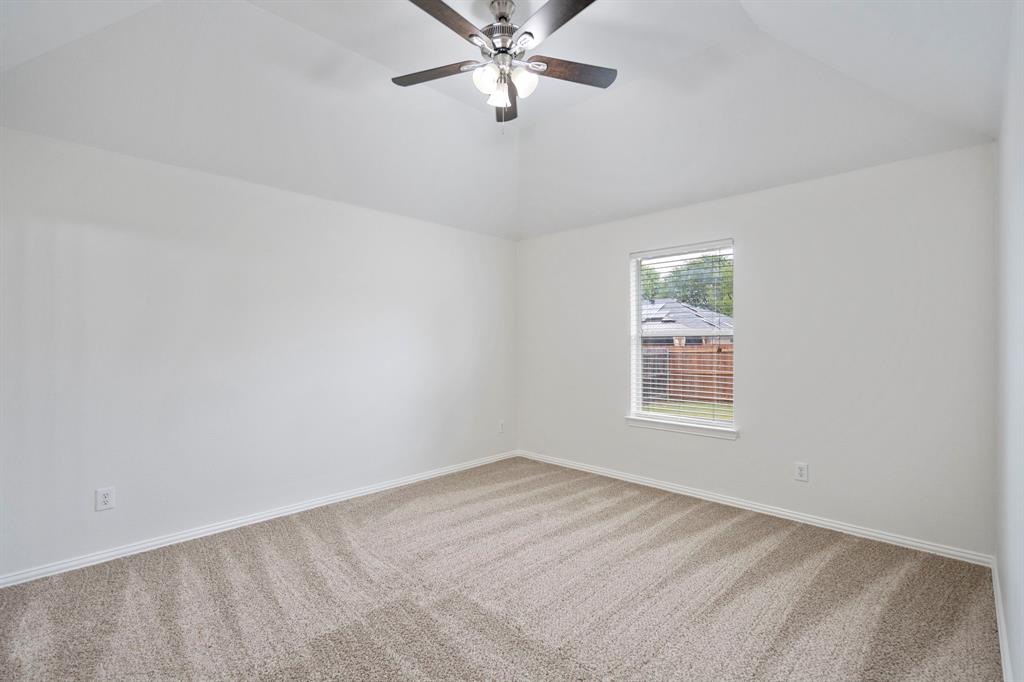 613 Hummingbird Trail Crowley, TX 76036 - Photo 23 of 37 an empty room with a window and ceiling fan
