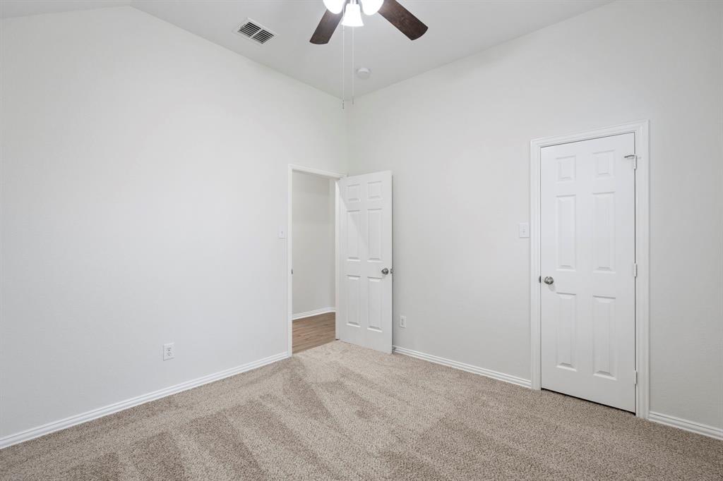 613 Hummingbird Trail Crowley, TX 76036 - Photo 27 of 37 an empty room with chandelier fan