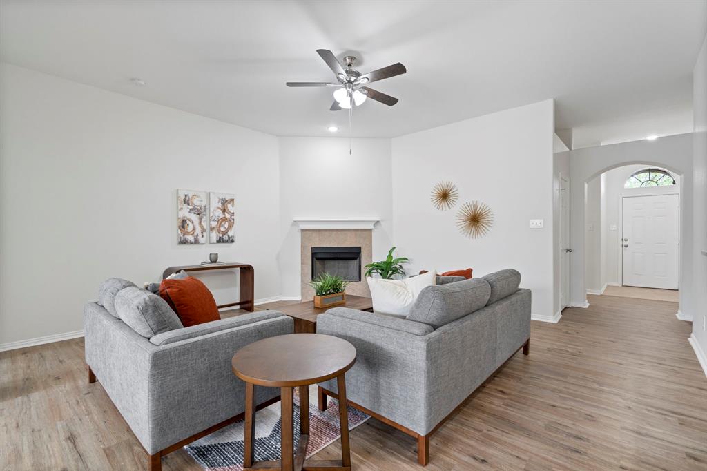 613 Hummingbird Trail Crowley, TX 76036 - Photo 7 of 37 a living room with furniture and a fireplace