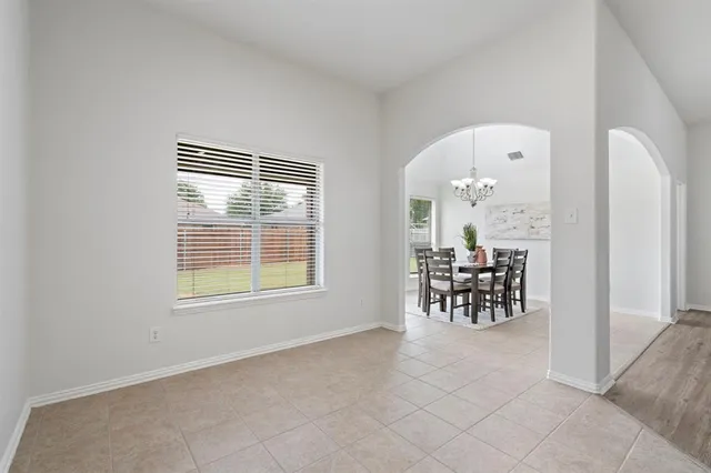 a view of kitchen with kitchen island and stainless steel appliances