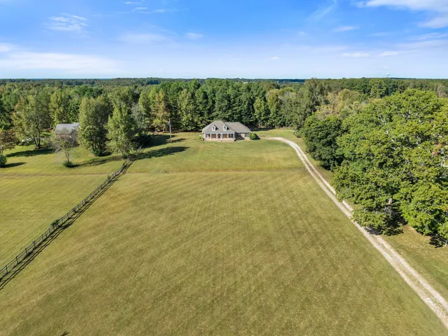 a house with trees in the background