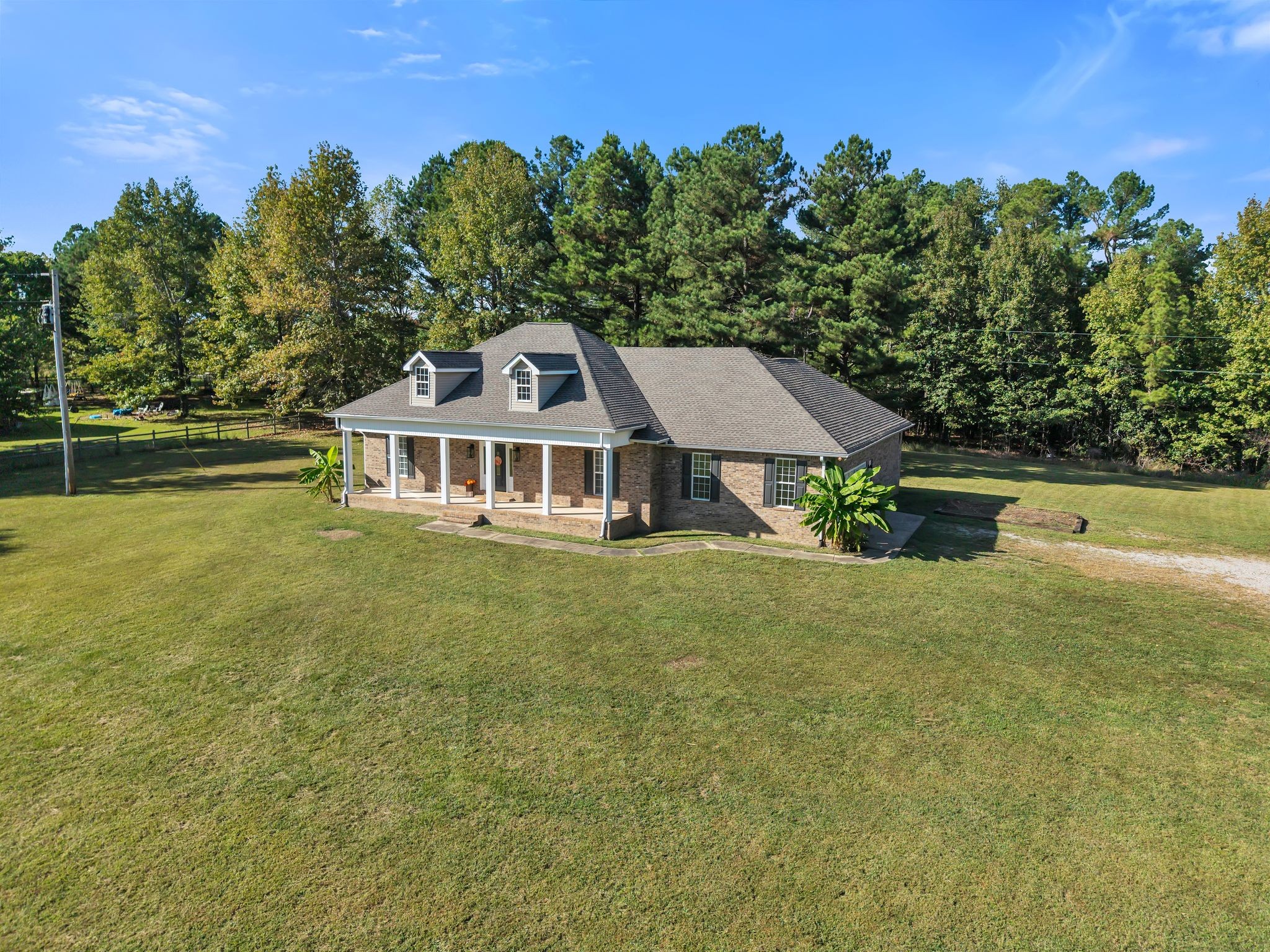 2044 Old Blacktop Road McEwen, TN 37101 - Photo 11 of 45 a front view of a house with a garden