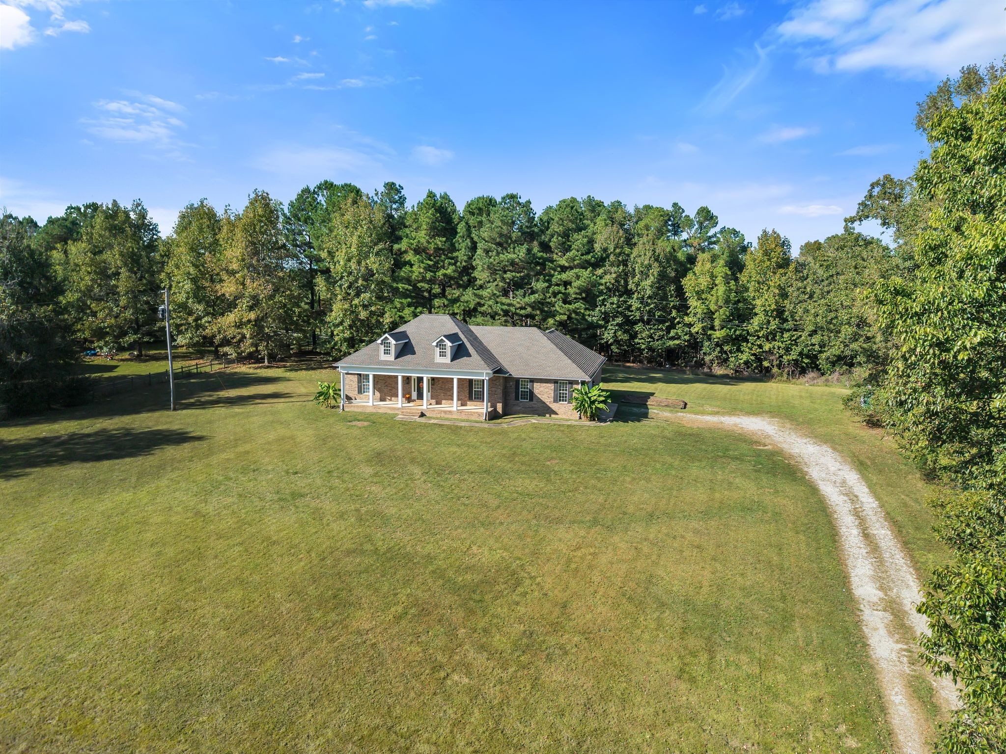 2044 Old Blacktop Road McEwen, TN 37101 - Photo 15 of 45 a view of a swimming pool with a yard and large tree