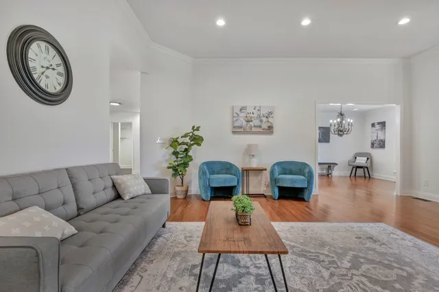 a living room with furniture a rug and a fireplace