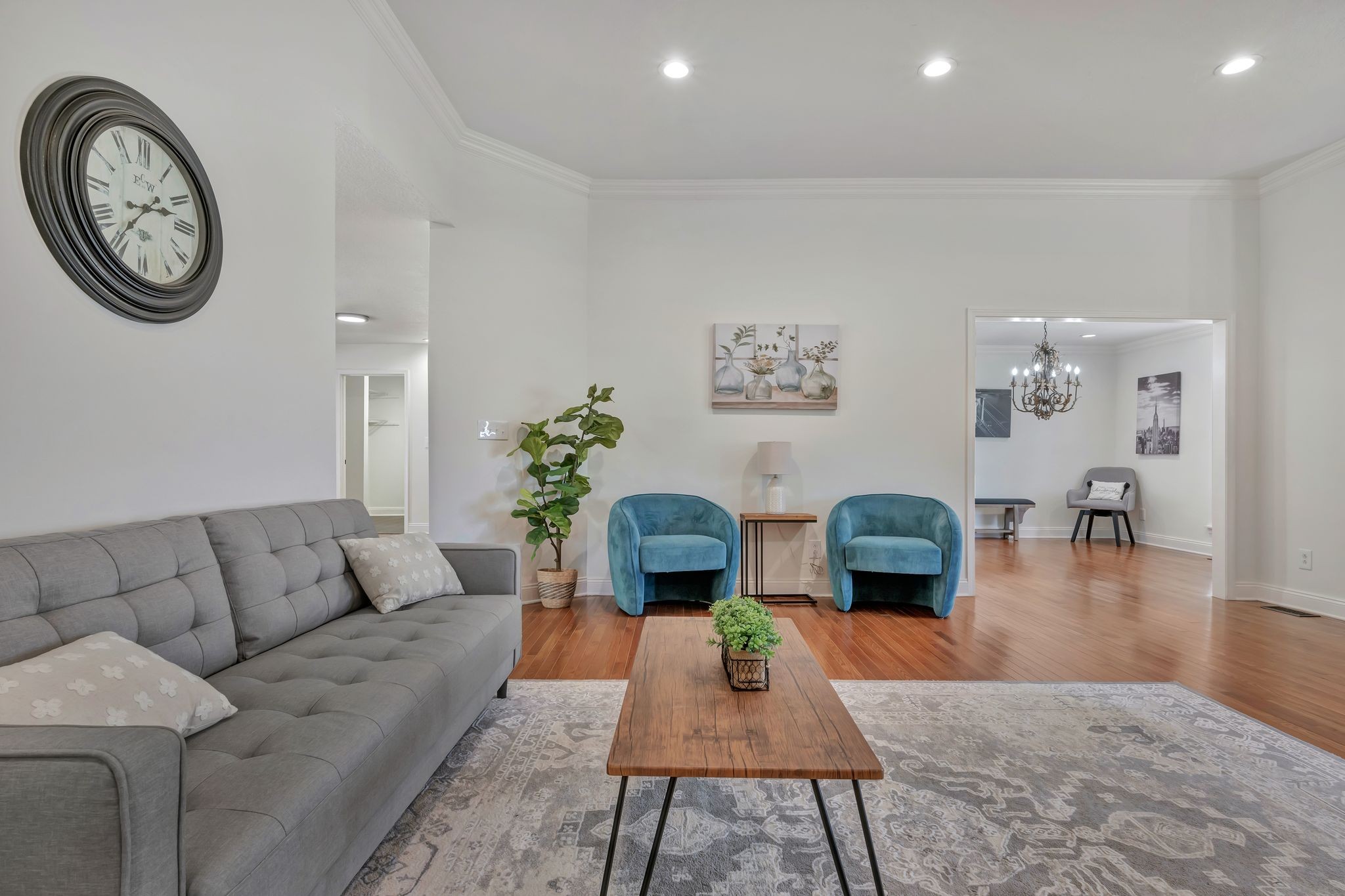 2044 Old Blacktop Road McEwen, TN 37101 - Photo 21 of 45 a living room with furniture a clock on wall and a table