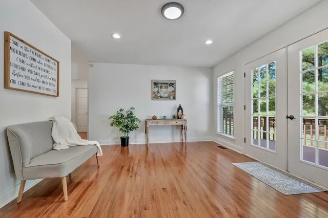 a dining room with furniture and window