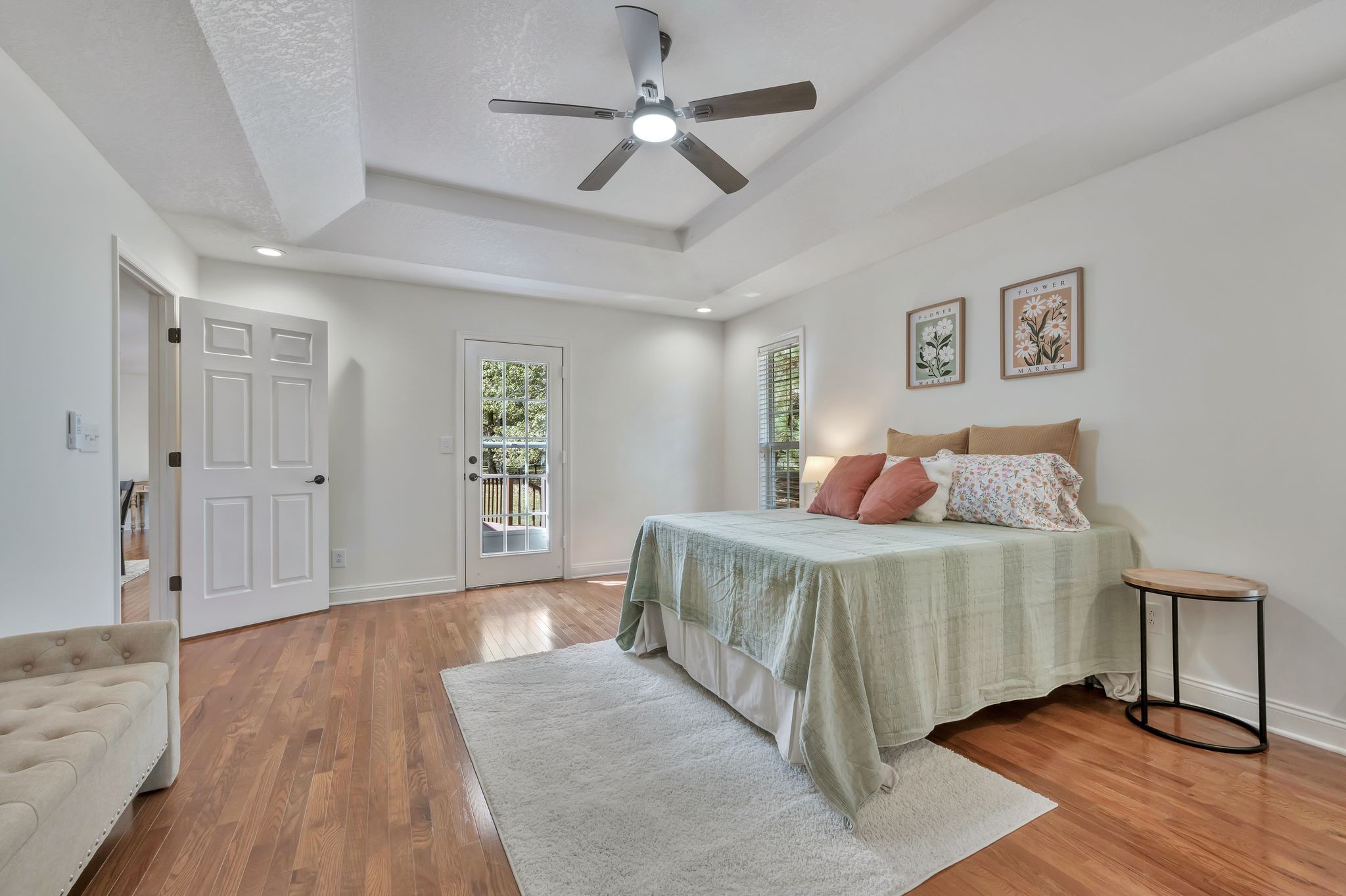 2044 Old Blacktop Road McEwen, TN 37101 - Photo 31 of 45 a bedroom with a large bed chandelier and a window