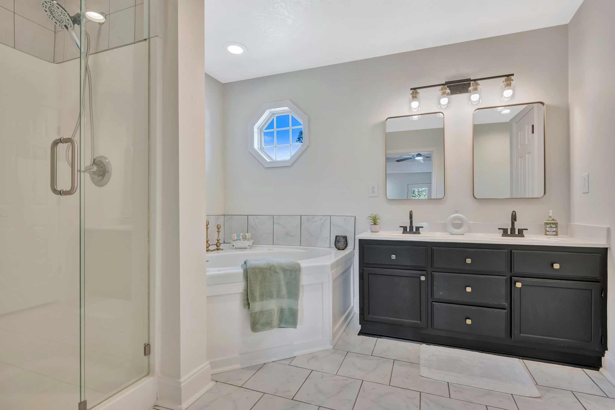 2044 Old Blacktop Road McEwen, TN 37101 - Photo 32 of 45 a spacious bathroom with a granite countertop sink mirror and shower