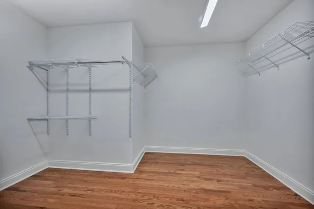 a view of room with wooden floor