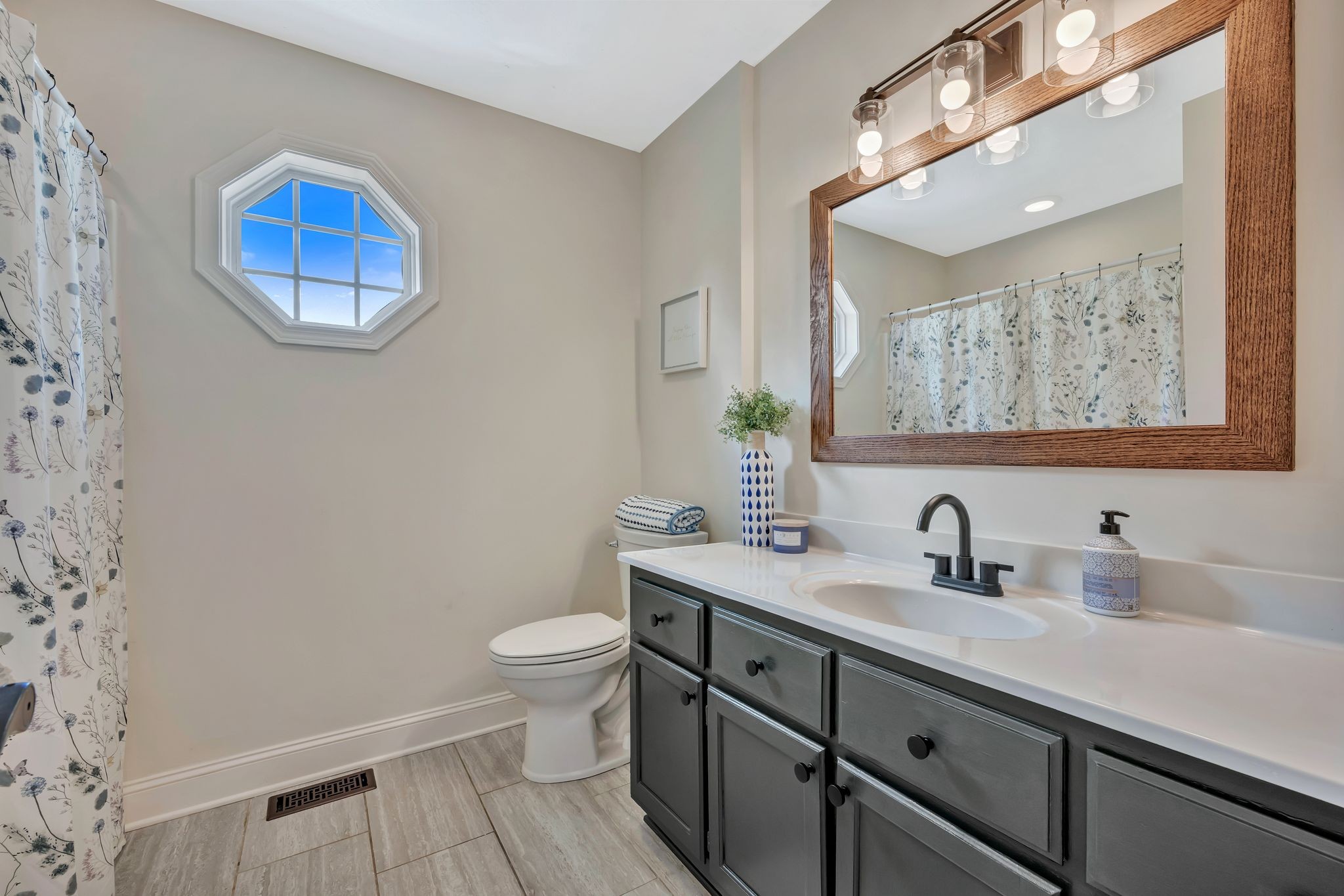 2044 Old Blacktop Road McEwen, TN 37101 - Photo 40 of 45 a bathroom with a sink and a mirror