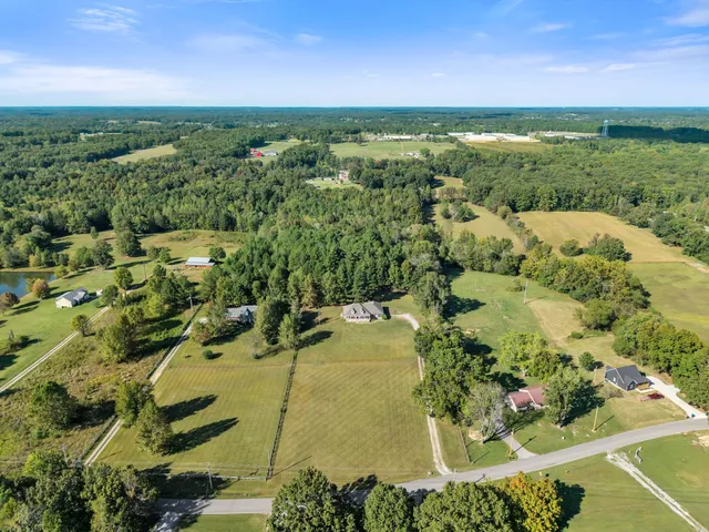 a view of a swimming pool from a yard