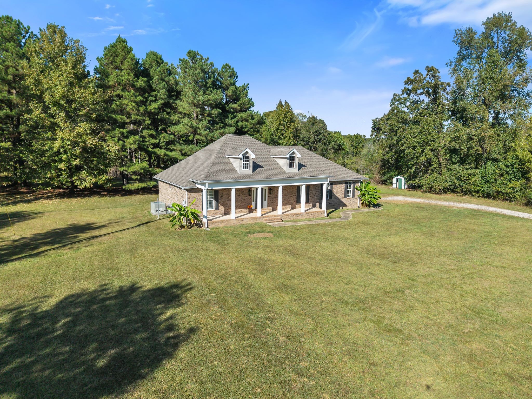 2044 Old Blacktop Road McEwen, TN 37101 - Photo 10 of 45 a front view of a house with a garden