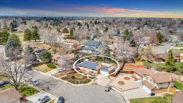 an aerial view of a swimming pool with outdoor seating