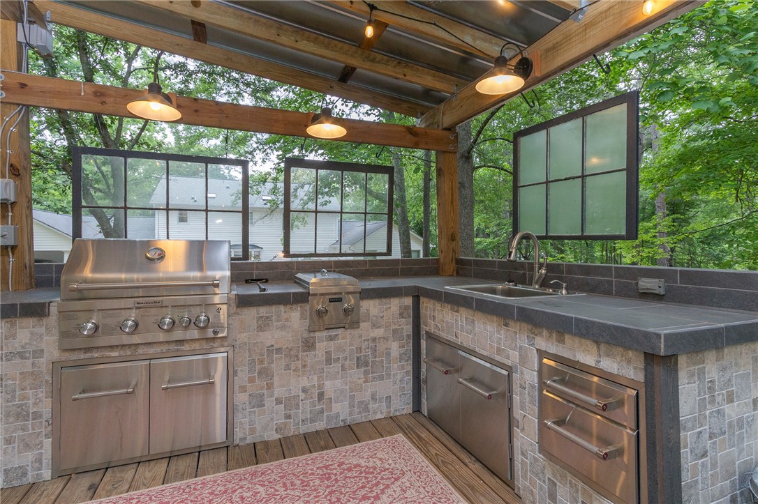 203 Oak Hollow Pendleton, SC 29670 - Photo 42 of 50 An outdoor haven features a complete cooking station for alfresco dining and entertaining.
