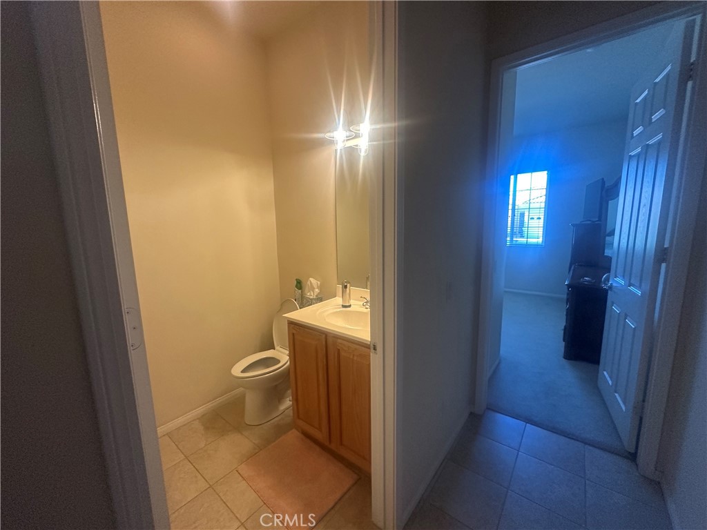 1185 Lantana Road Beaumont, CA 92223 - Photo 17 of 36 a bathroom with a toilet and a sink