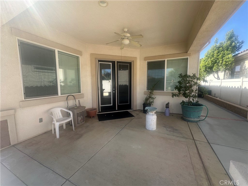 1185 Lantana Road Beaumont, CA 92223 - Photo 2 of 36 a view of a patio with chairs and potted plants