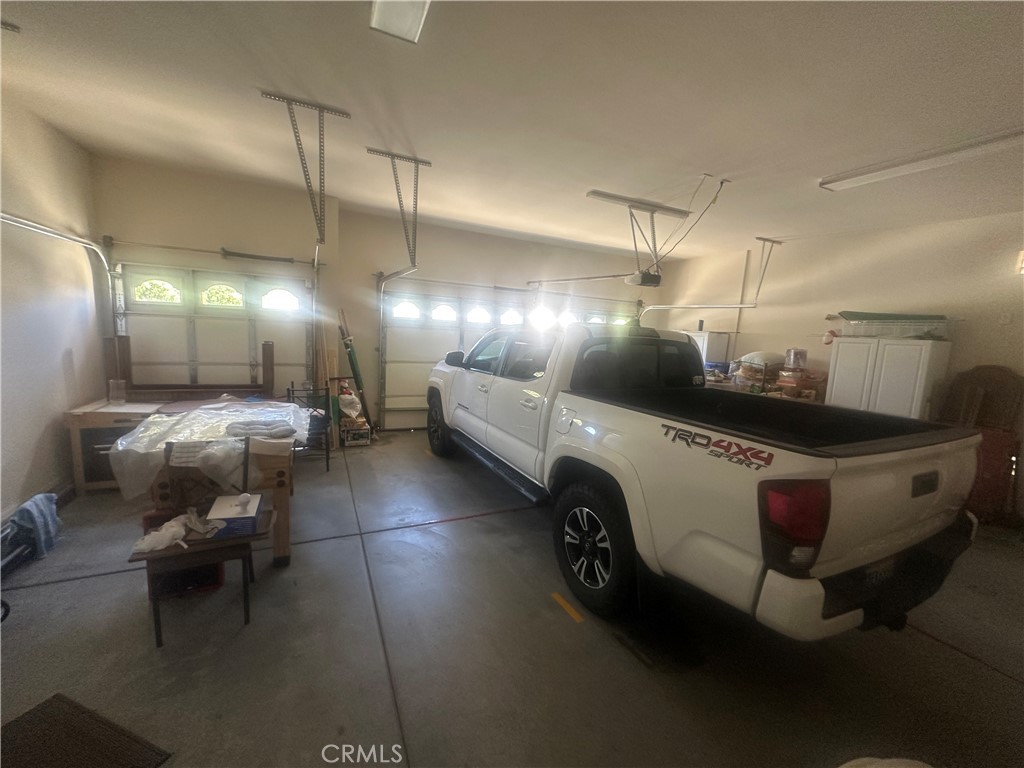 1185 Lantana Road Beaumont, CA 92223 - Photo 21 of 36 a bathroom with a lot of light fixture and a table