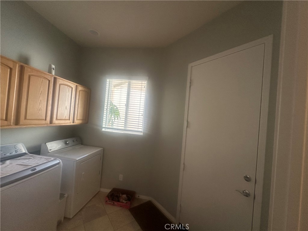 1185 Lantana Road Beaumont, CA 92223 - Photo 22 of 36 a bathroom with a sink toilet and a window