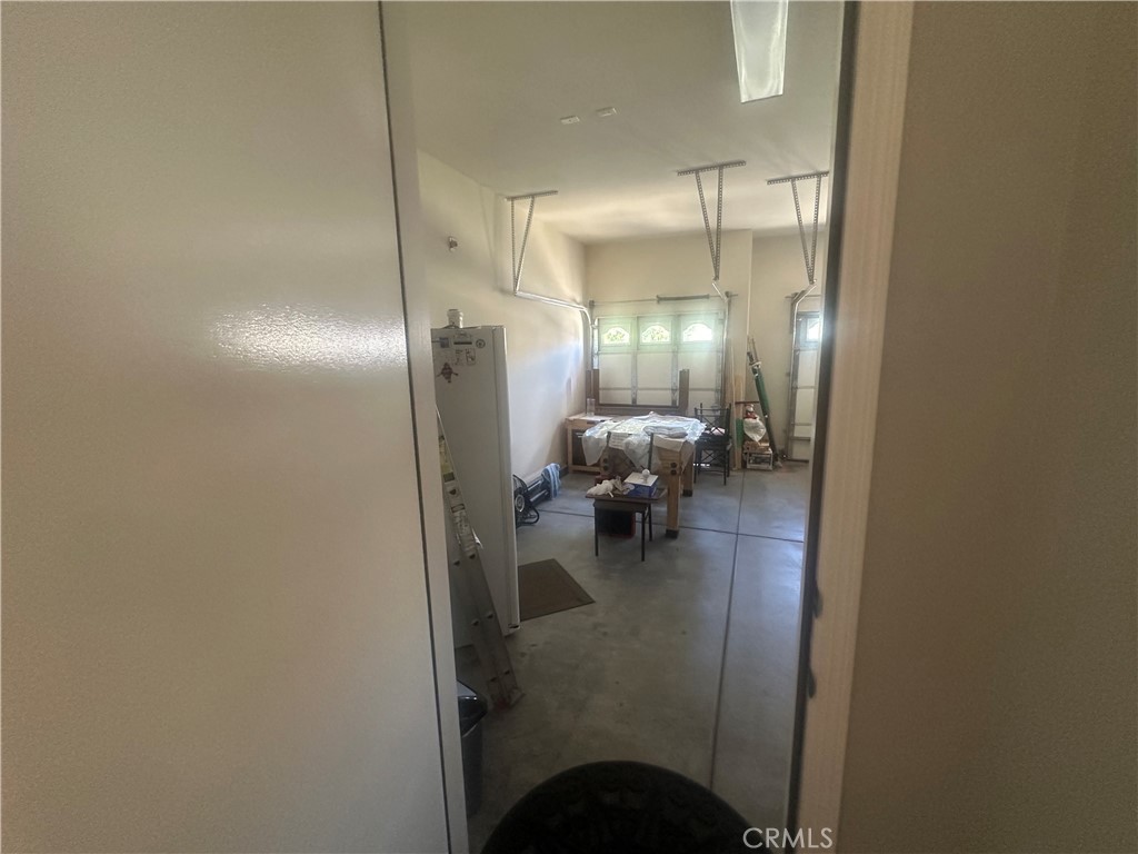 1185 Lantana Road Beaumont, CA 92223 - Photo 23 of 36 a view of a hallway with livingroom