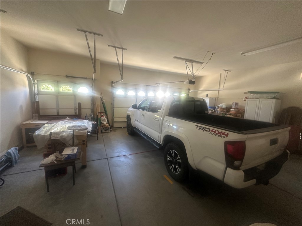 1185 Lantana Road Beaumont, CA 92223 - Photo 24 of 36 a bathroom with a lot of light fixture and a table