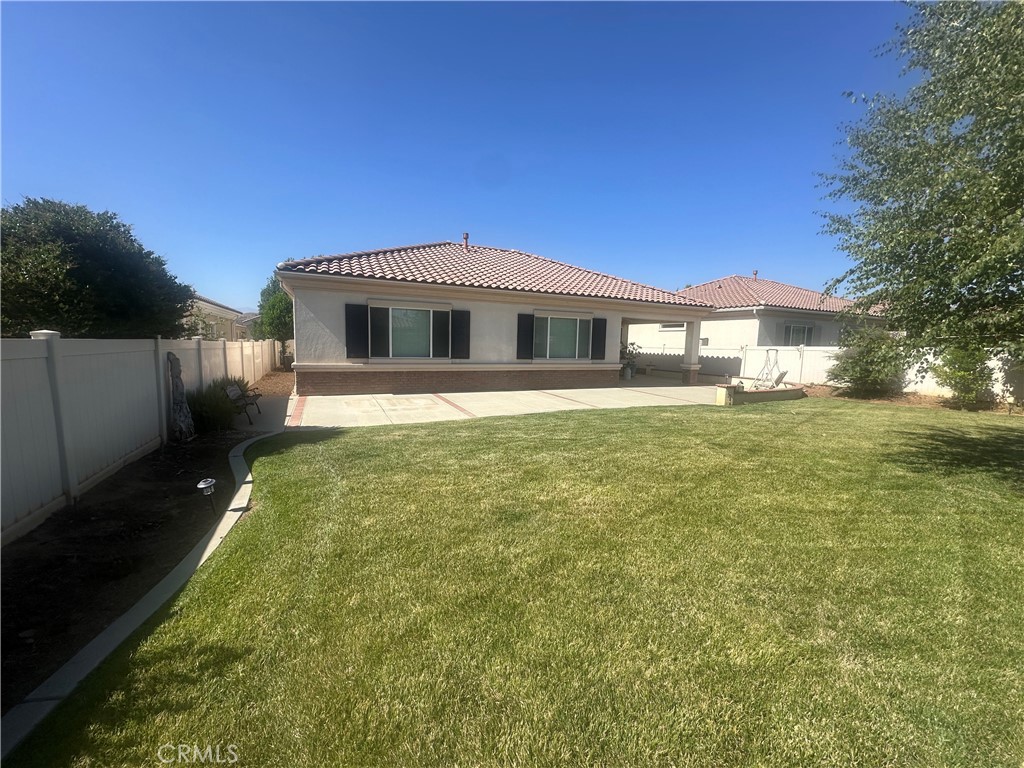 1185 Lantana Road Beaumont, CA 92223 - Photo 25 of 36 a front view of a house with a yard