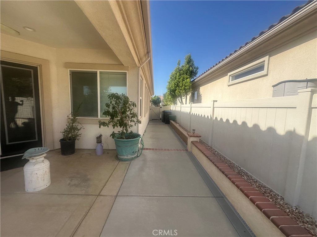 1185 Lantana Road Beaumont, CA 92223 - Photo 28 of 36 a view of a balcony with chairs and potted plants