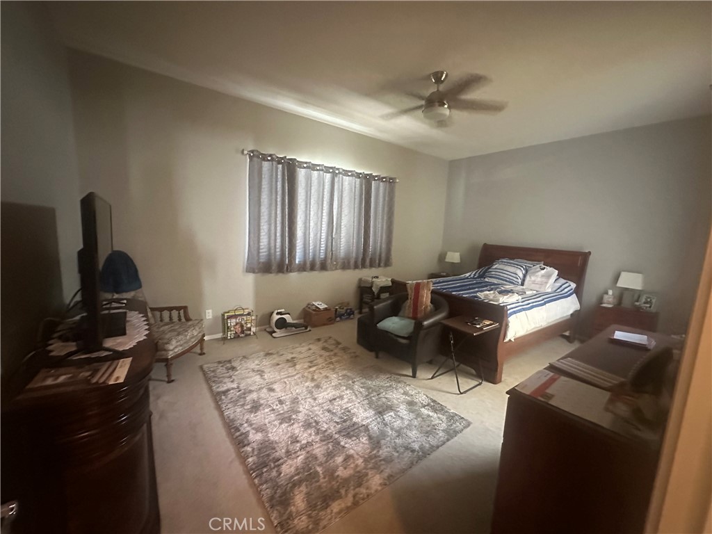 1185 Lantana Road Beaumont, CA 92223 - Photo 32 of 36 a kitchen with a sink appliances and cabinets