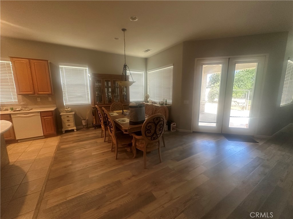 1185 Lantana Road Beaumont, CA 92223 - Photo 5 of 36 a view of a dining room with furniture and chandelier