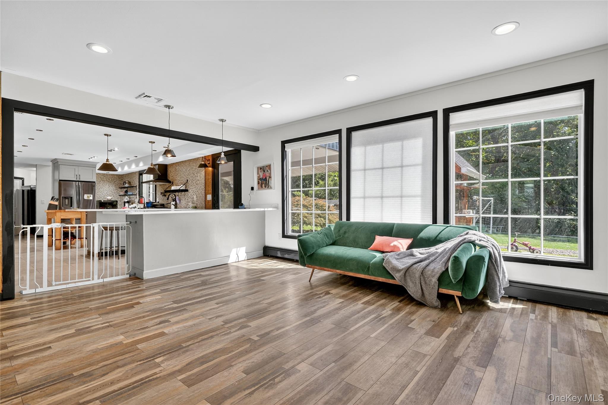 306 South Pascack Road Nanuet, NY 10954 - Photo 11 of 48 Living room with light wood-style flooring, recessed lighting, and a baseboard heating unit