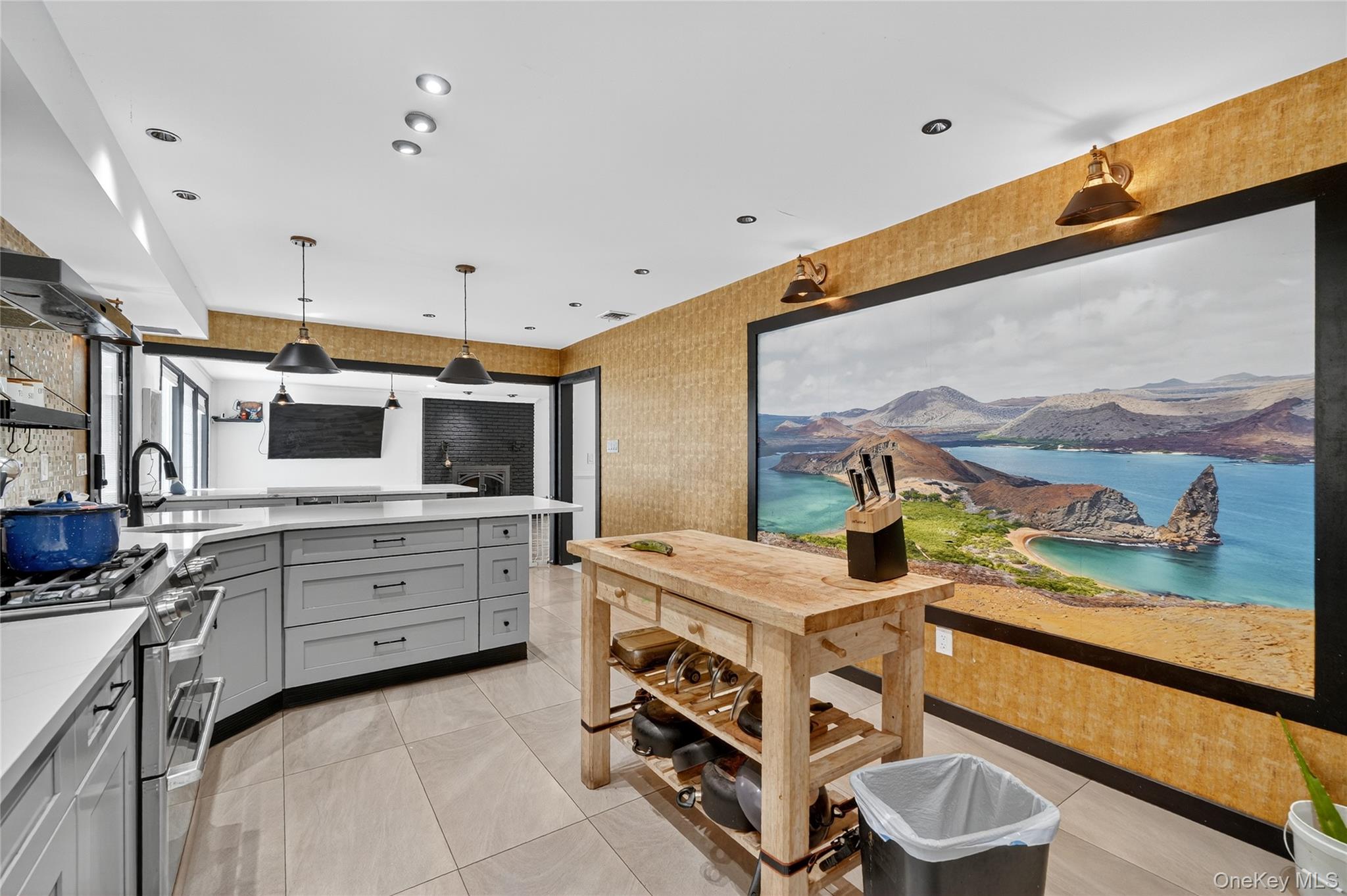 306 South Pascack Road Nanuet, NY 10954 - Photo 18 of 48 Kitchen featuring double oven range, decorative light fixtures, gray cabinets, light tile patterned floors, and wallpapered walls