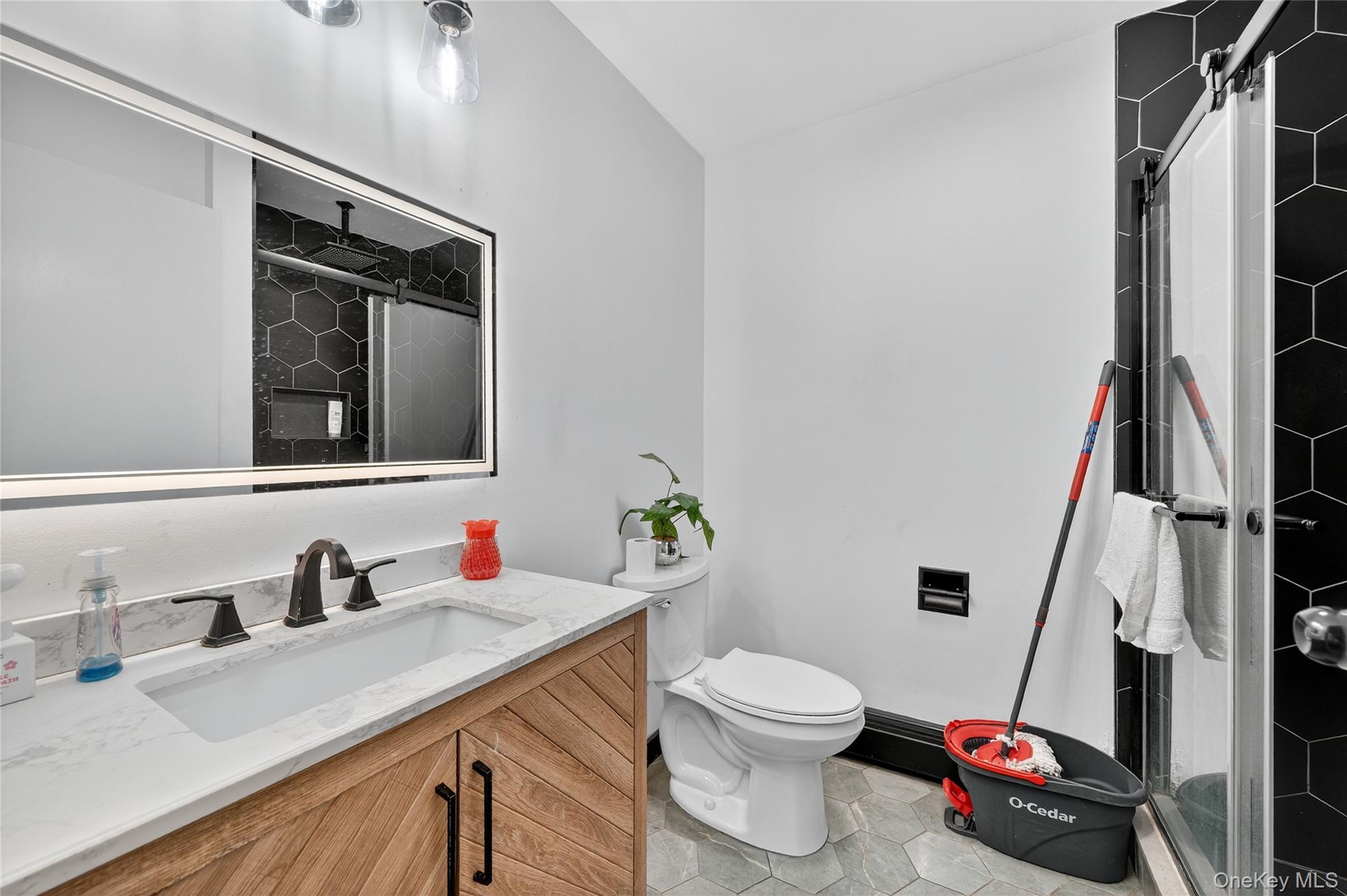306 South Pascack Road Nanuet, NY 10954 - Photo 21 of 48 Full bath with a shower stall, vanity, and light tile patterned flooring