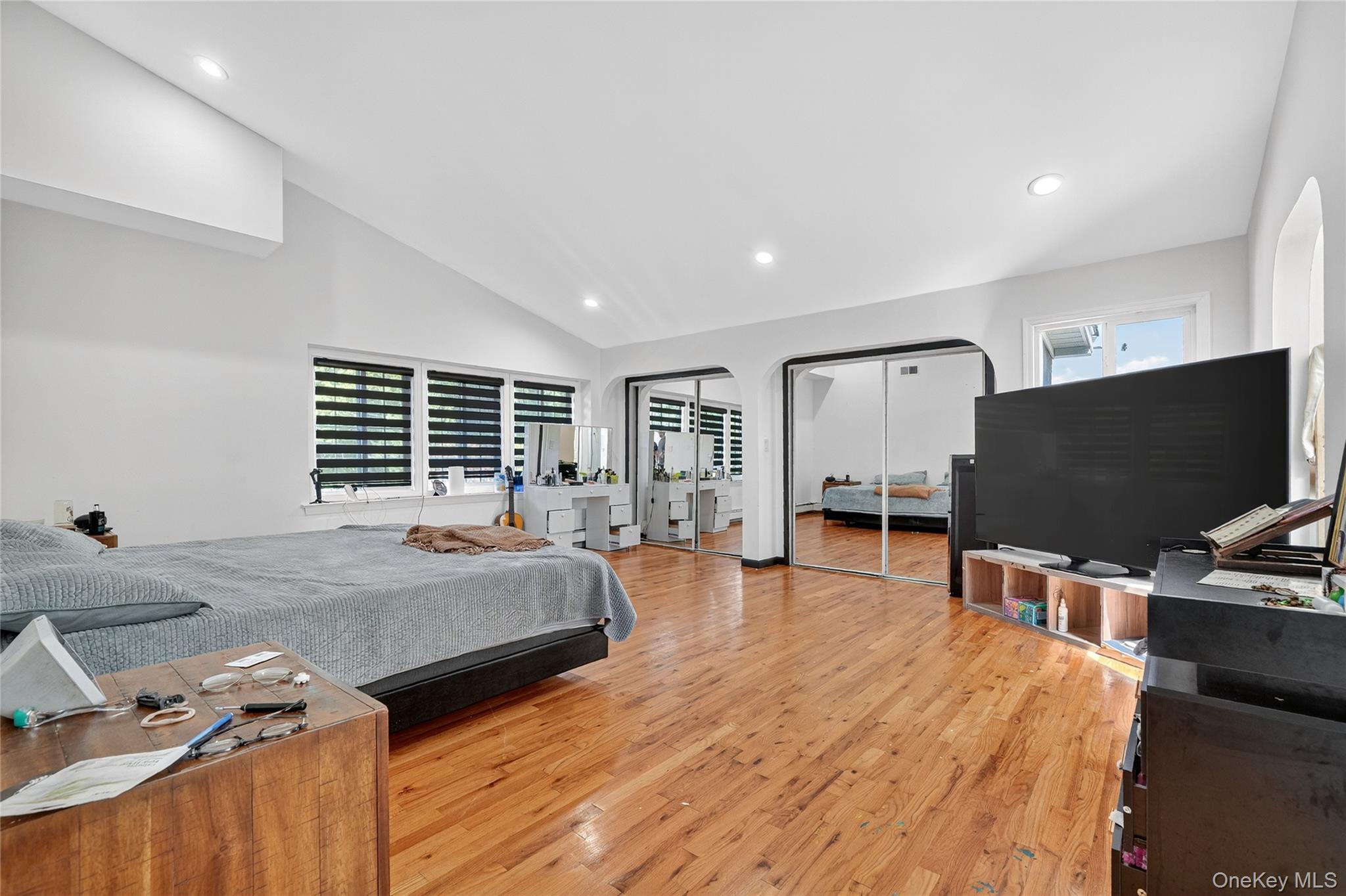 306 South Pascack Road Nanuet, NY 10954 - Photo 28 of 48 Bedroom featuring two closets, light wood-type flooring, vaulted ceiling, and recessed lighting