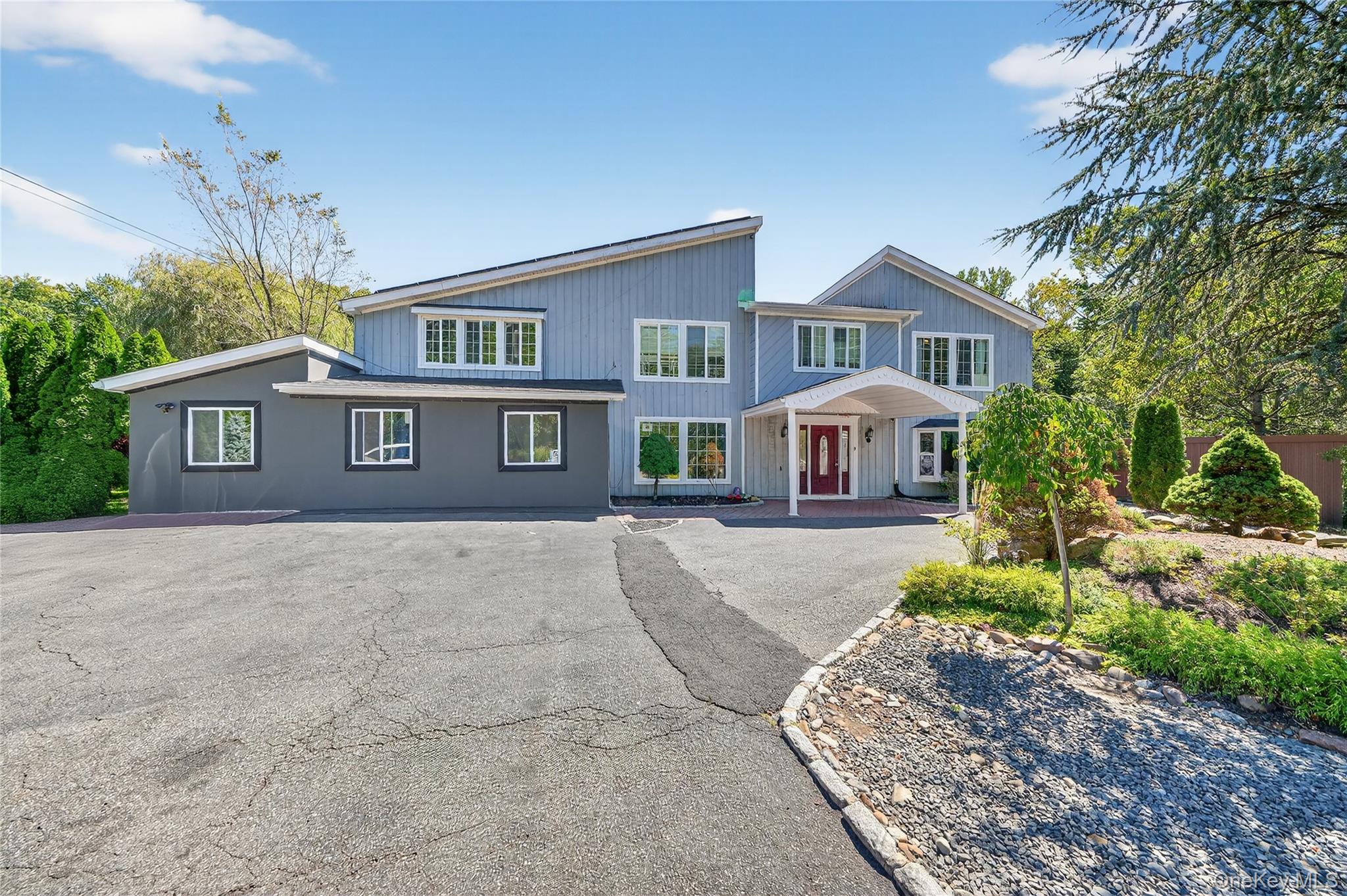 306 South Pascack Road Nanuet, NY 10954 - Photo 3 of 48 View of front of property with asphalt driveway and covered porch