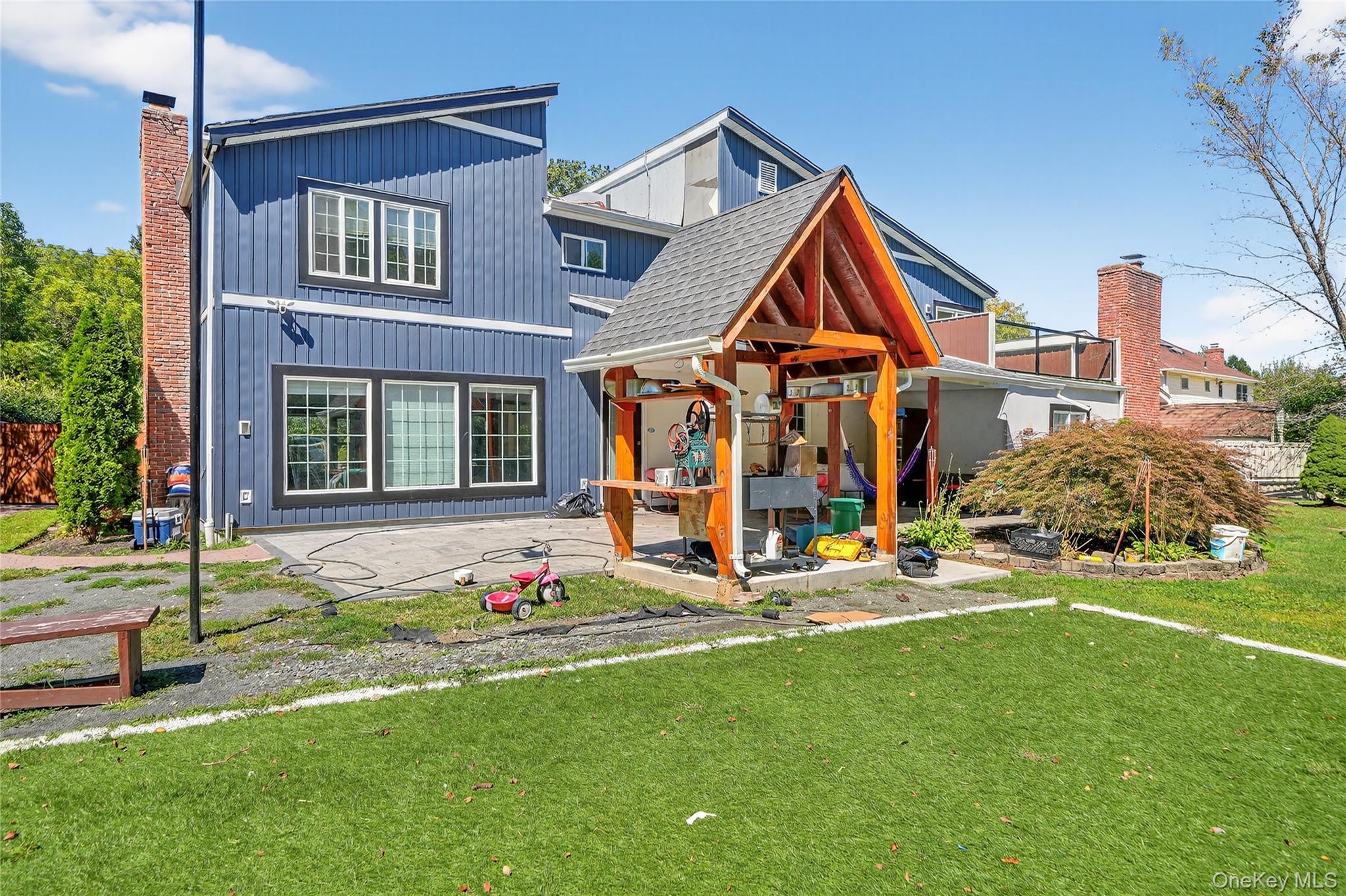 306 South Pascack Road Nanuet, NY 10954 - Photo 35 of 48 View of front of house with a patio area and a front lawn