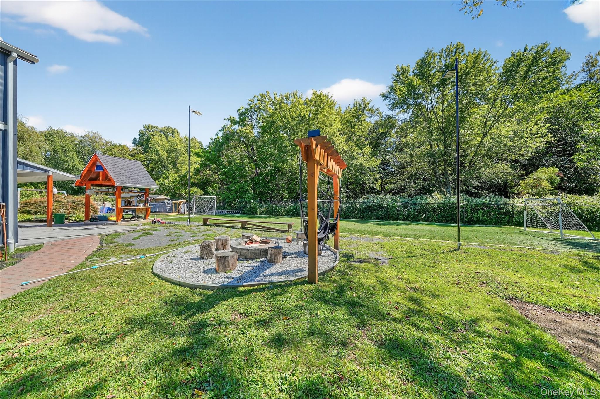 306 South Pascack Road Nanuet, NY 10954 - Photo 39 of 48 View of grassy yard with a patio and view of scattered trees