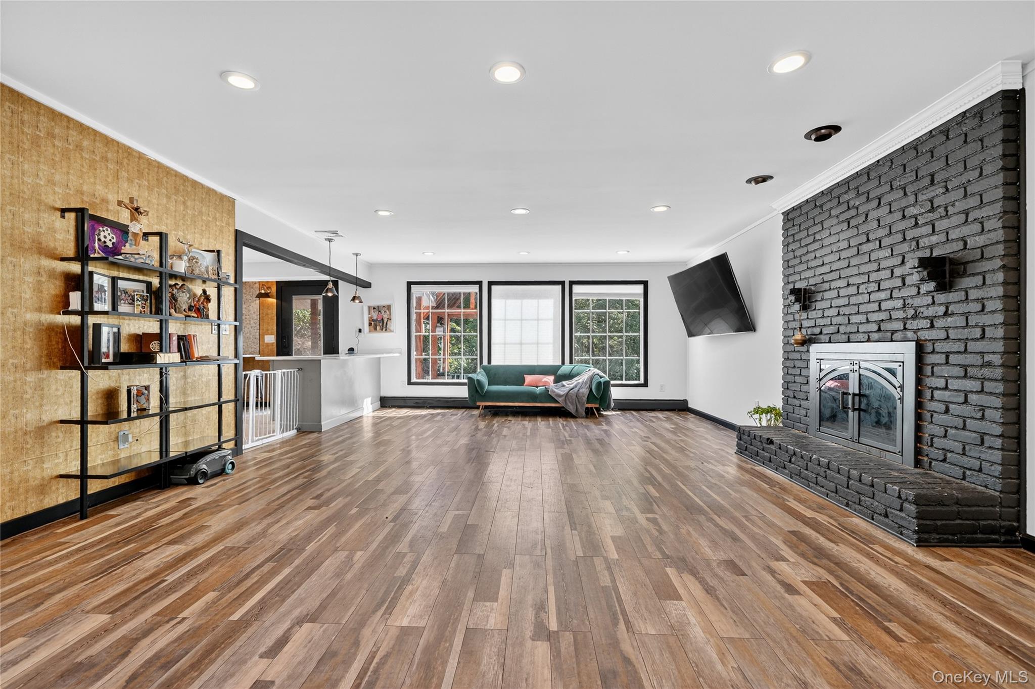 306 South Pascack Road Nanuet, NY 10954 - Photo 9 of 48 Living area featuring light wood-type flooring, a fireplace, ornamental molding, and recessed lighting