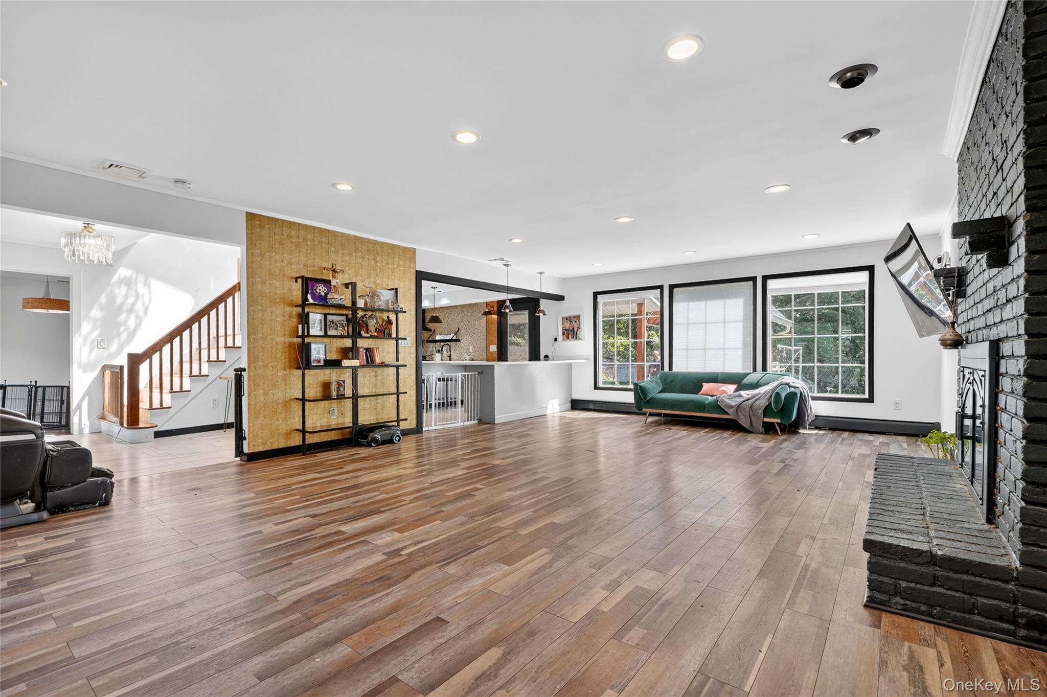 306 South Pascack Road Nanuet, NY 10954 - Photo 10 of 48 Living room featuring a fireplace, light wood finished floors, recessed lighting, and stairway