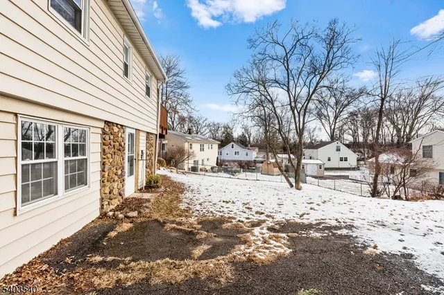 a view of a yard covered in snow