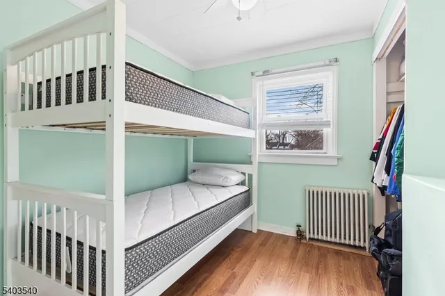 a bedroom with windows